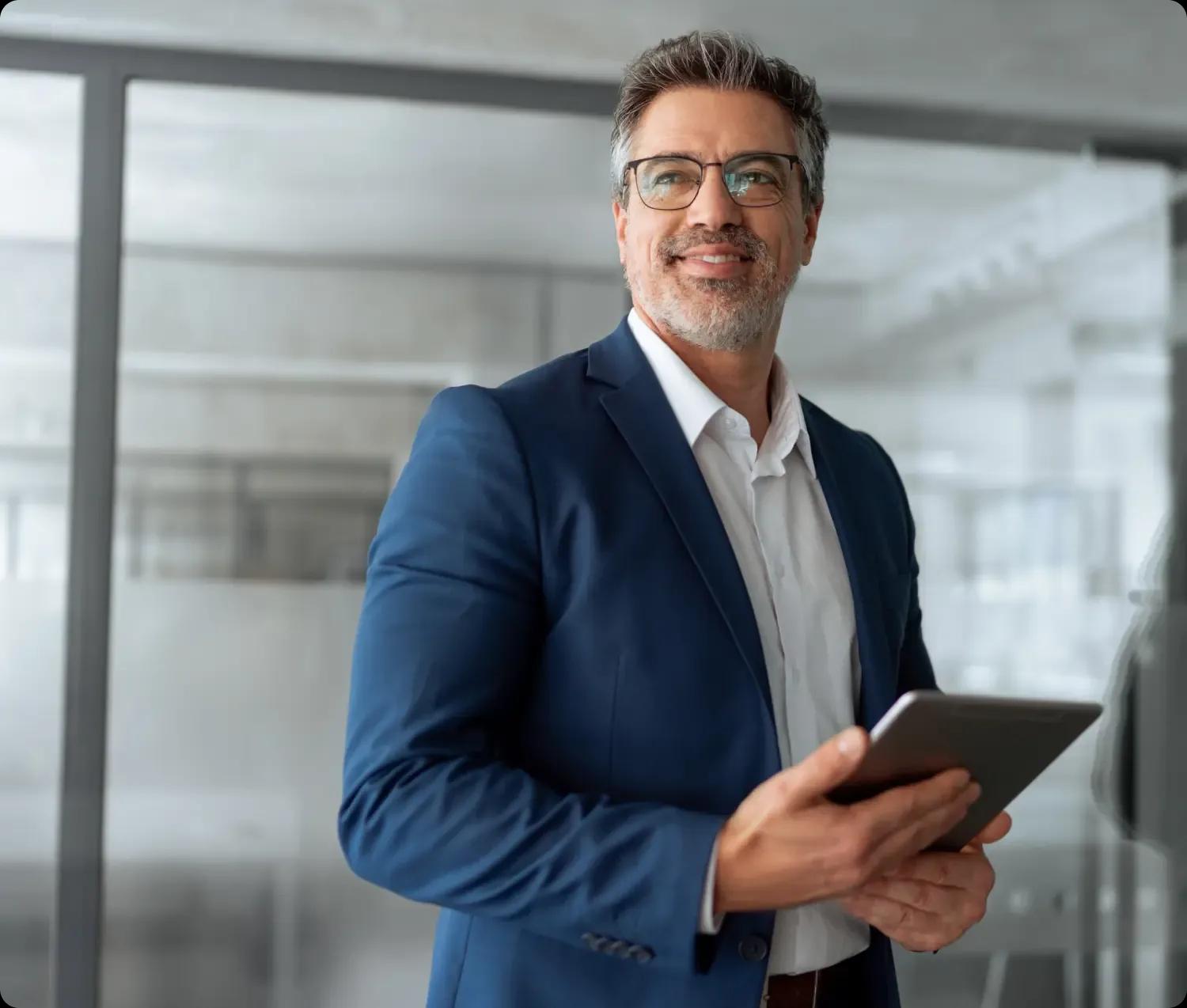 Image of a CFO working on his tablet during a meeting