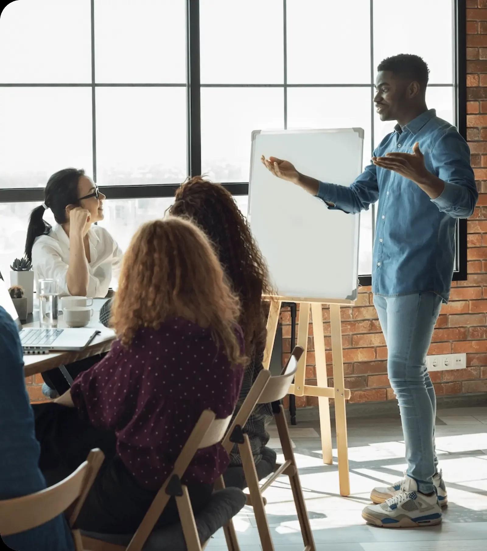 A speaker delivers a presentation to an attentive group.