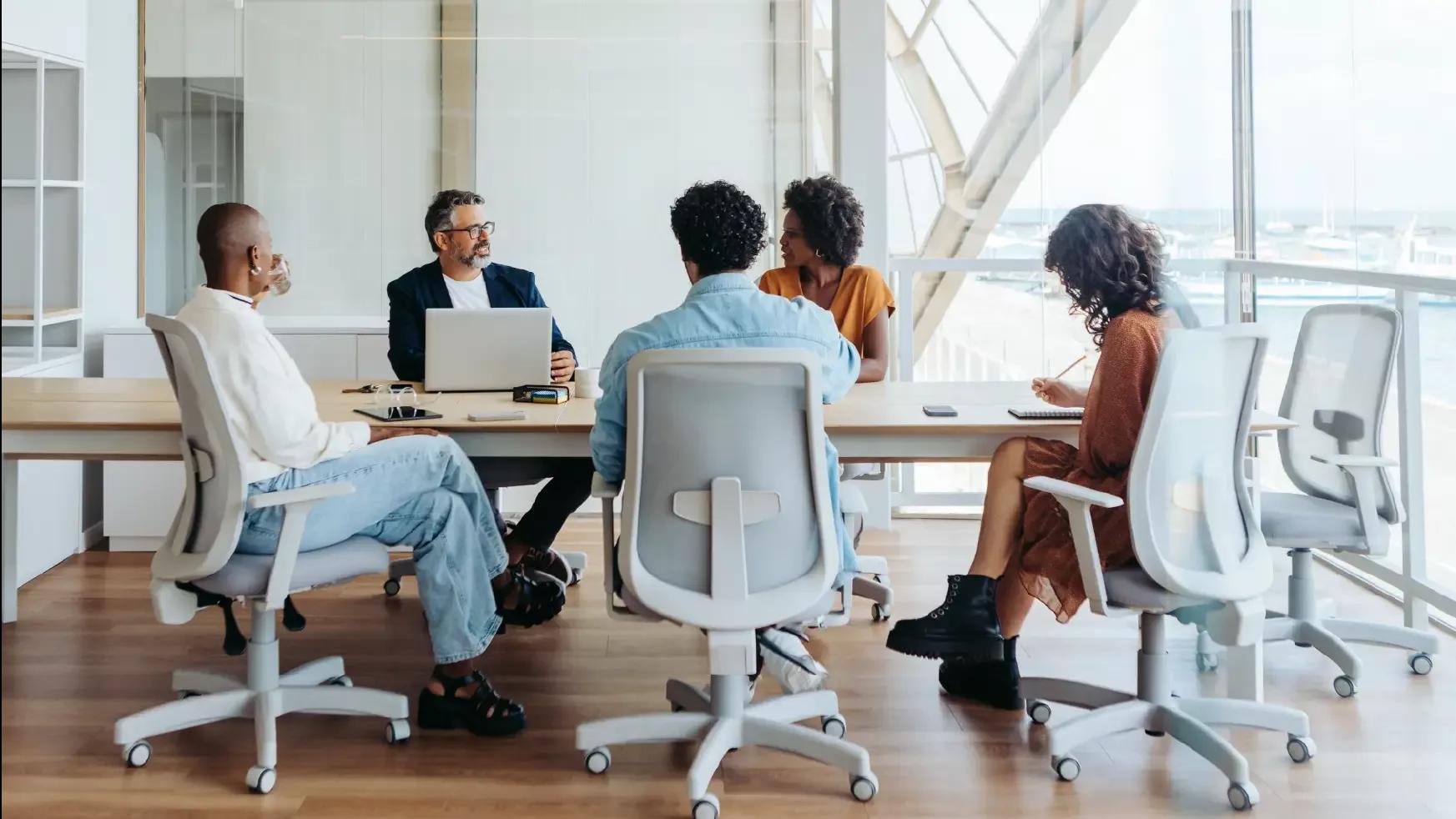Group of Kyriba employees discussing treasury