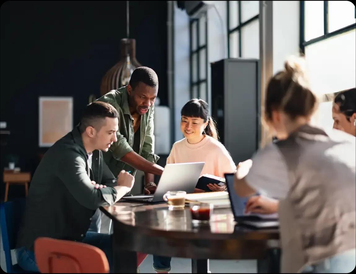 Group of people discussing the Kyriba partner hub to submit and track leads, view our sales and pre-sales enablement materials, view training documents and courses, and access marketing collateral.